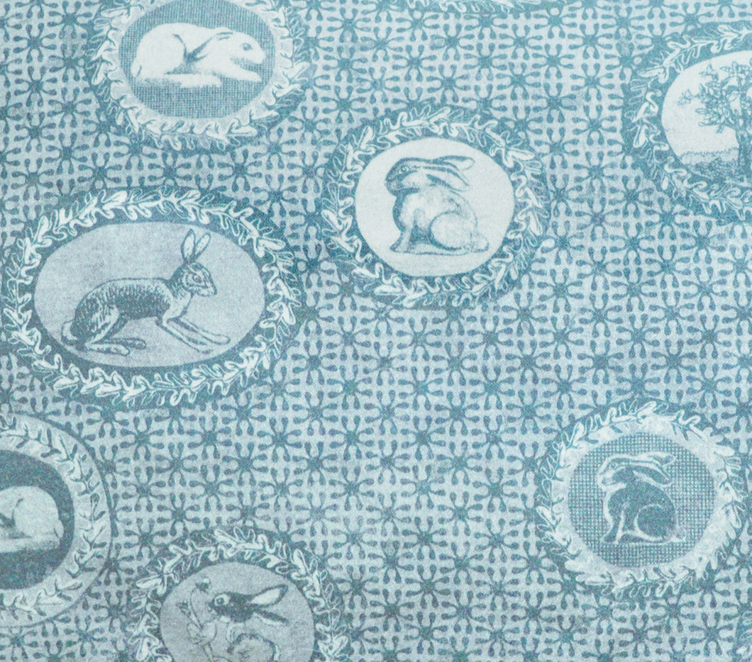 Toile de Jouy style fabric,with rabbits and bunnies printed faded turquoise blue colour,classic style independent designer,textiles,patterns by the metre.