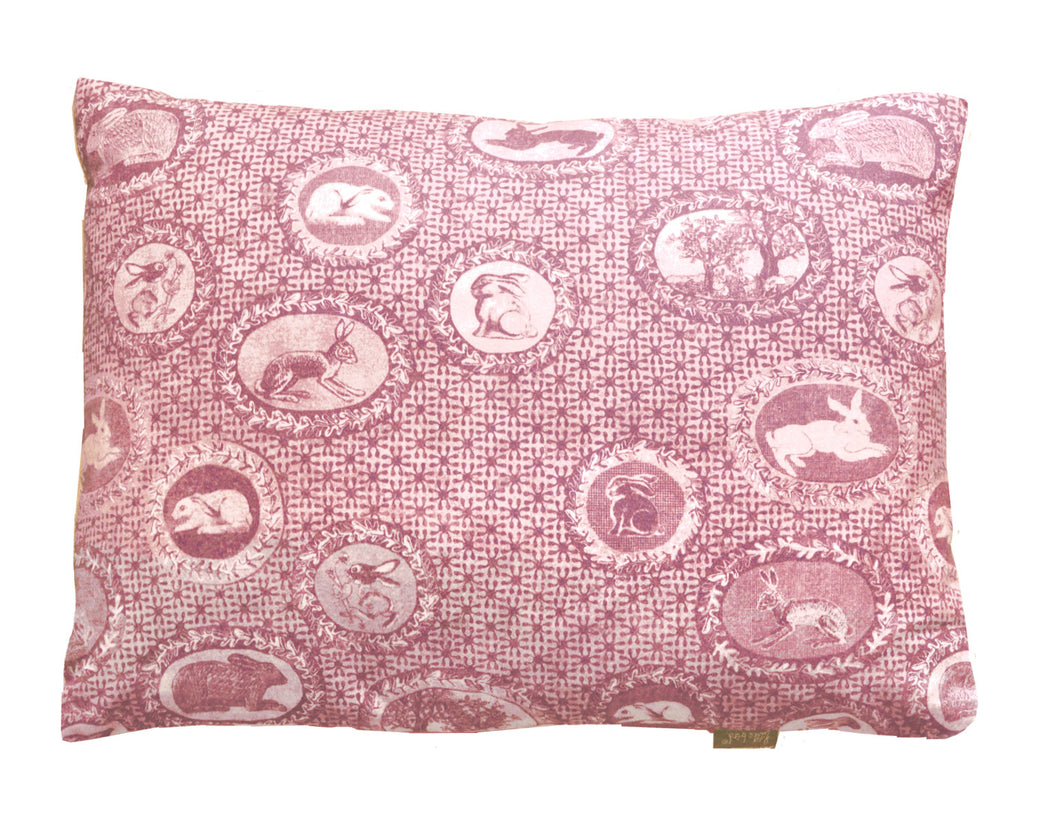 patterned cotton cushion,bunnies and rabbits printed in faded red,a twist on Toile de jouy,English designer based in Norfolk.Pattern lovers choice.